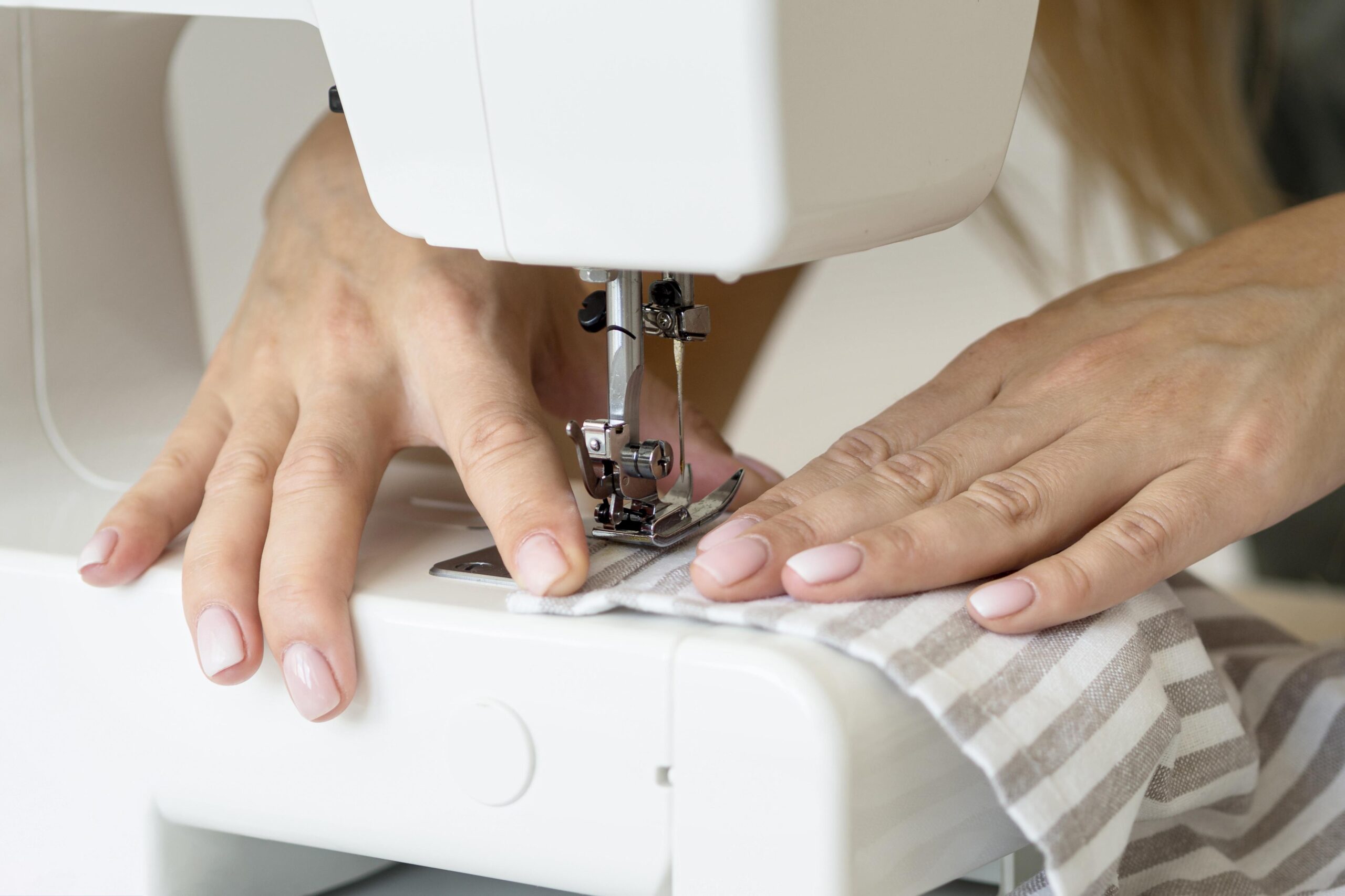 Woman-sewing-textile